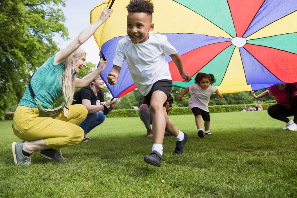 young children running around and smiling