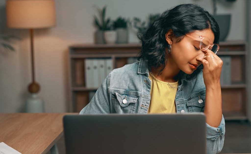 Burned out youth feeling stressed and overwhelmed with her workload