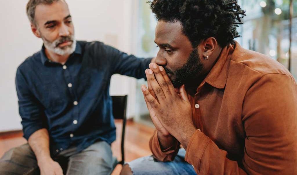 Intense moment of emotion at addiction counselling session