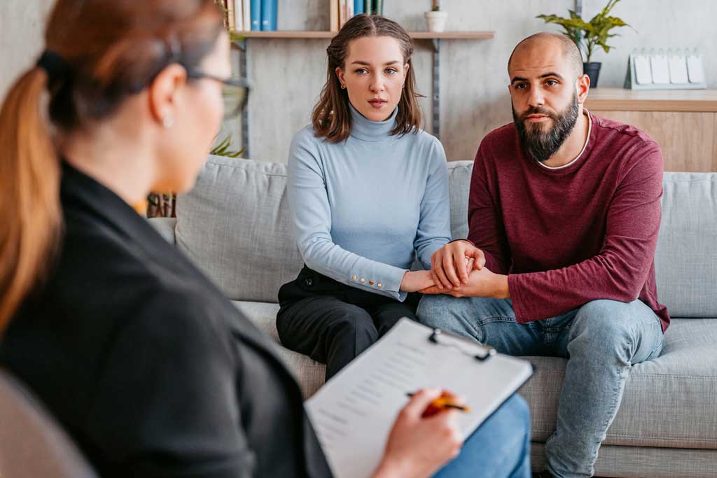 Couple at counselling session talking to therapist