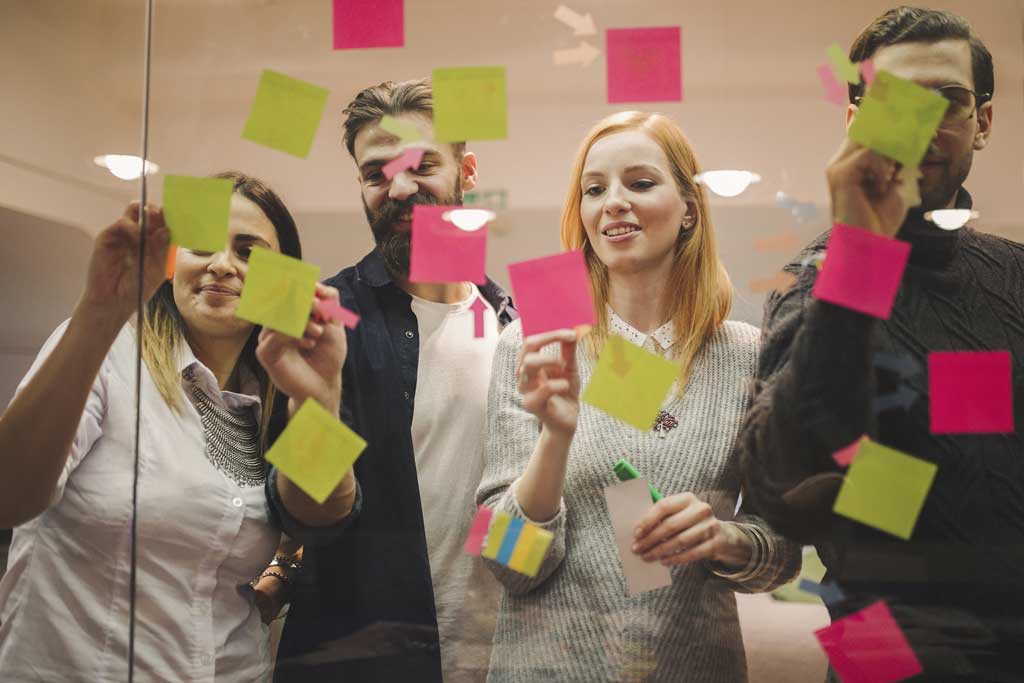 Giving motivational sticky notes to out team